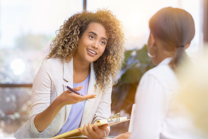 female psychologist talking with patient