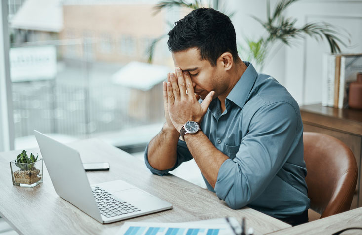 stressed young businessman at work