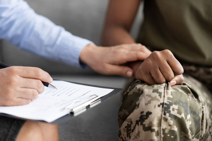 soldier being comforted by therapist