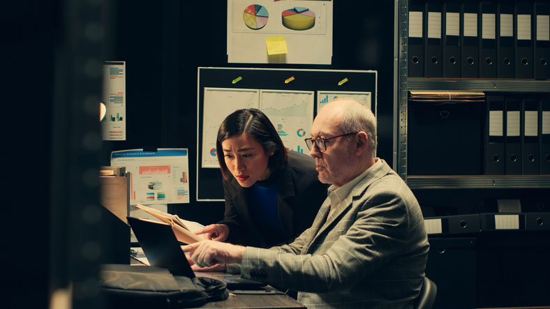 female student with professor in viewing room