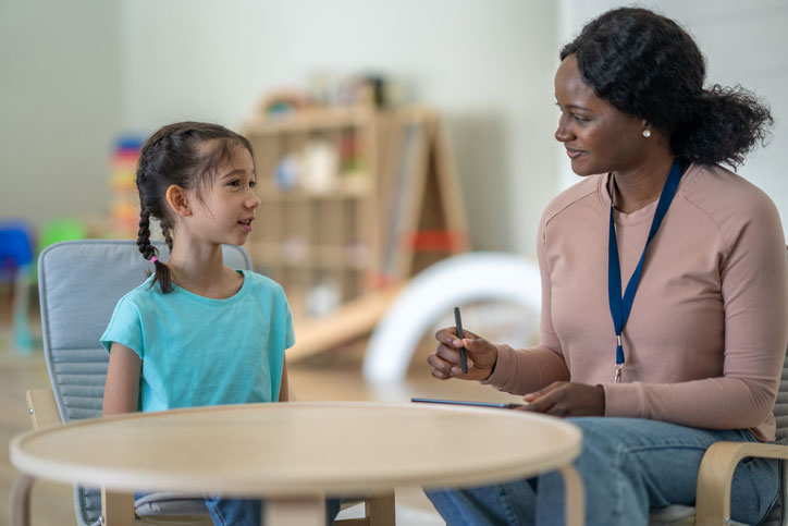 child talking with psychologist