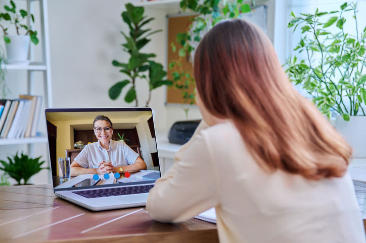 young woman online with psychologist