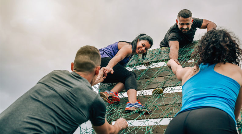 helping each other over obstacle