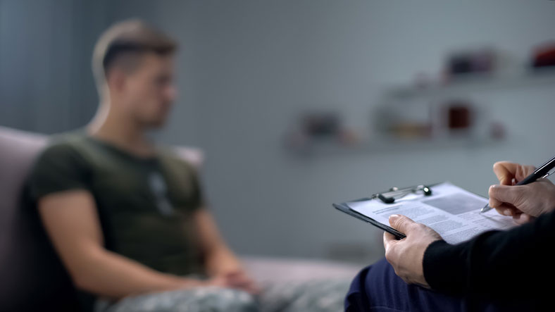 soldier talking in therapy with psychologist