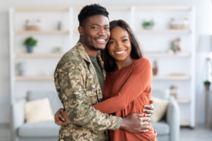 soldier husband hugging his wife