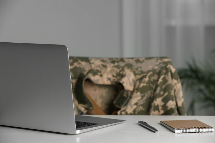 soldier's empty chair and laptop on desk