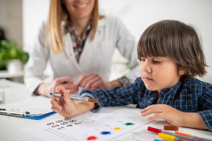 neuropsychologist working with young boy